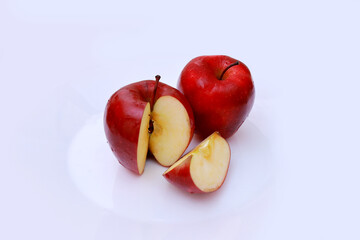 two red apples on white background