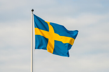 Large swedish flag waving in the breeze.
