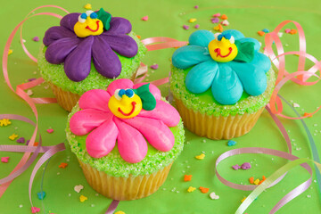 Cupcakes baked and decorated with fun festive frosting and colorful sprinkles