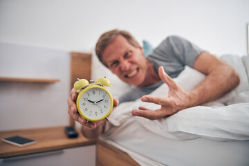 Focused photo on angry man oversleeping his meeting
