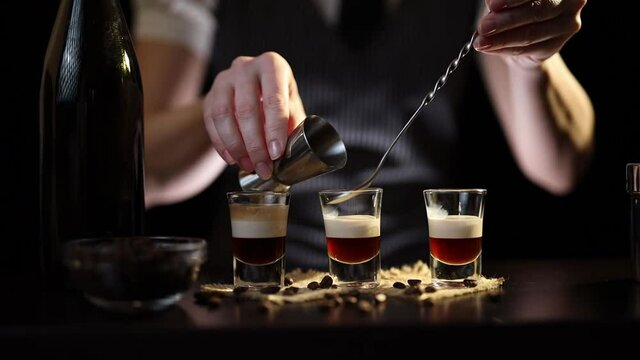 Bartender preparing B-52 cocktail