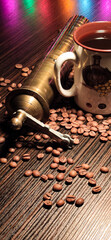 Coffee cup on roasted coffee beans.