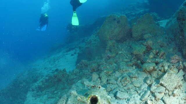 amphora pieces underwater ancient antic amphoras scuba divers exploring and discovering deep water