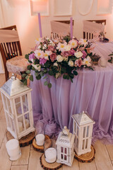 Wedding flowers on the banquet table. Table decoration. Table setting and decorations.