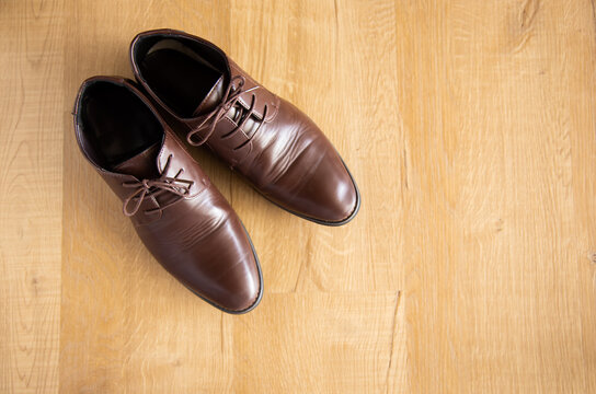 brown man leather shoe