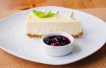 Slice of cheesecake and fruits