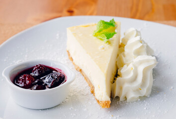 Slice of cheesecake and fruits