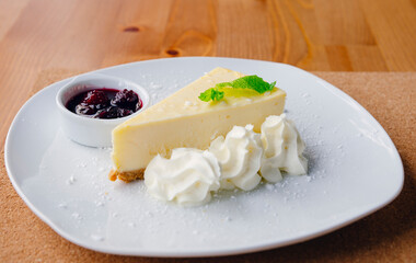 Slice of cheesecake and fruits