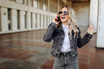 Blonde young woman talking on the phone