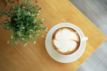 cup of coffee on wooden table