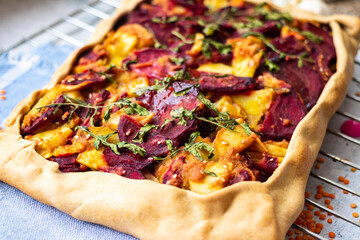 Open tart with vegetables - beetroot and potato. Vegan food