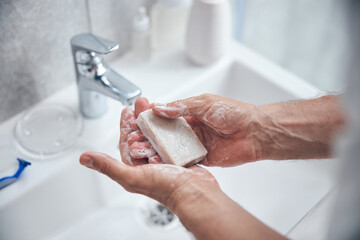 Male taking care of his hand hygiene