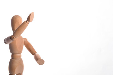 Wooden figure mannequin posing in action isolated on white background.