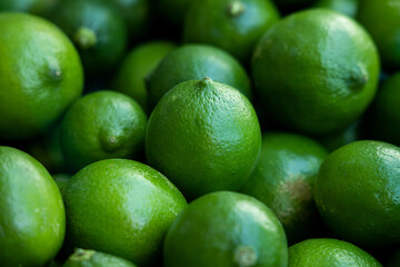 Many green lemons together - healthy citrus fruits