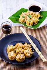 Dim sum on black plate