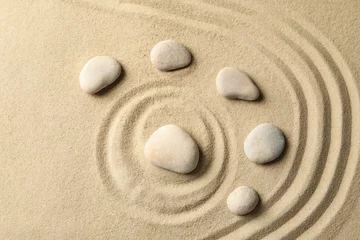 Fotobehang Zen Stenen Stones on the sand with patterns. Zen concept  © Atlas