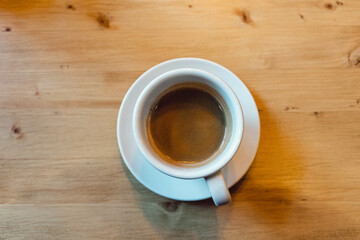 cup of coffee on wooden table