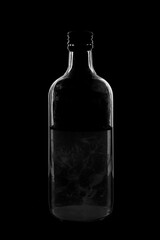 Silhouette of a bottle with a beautiful shape on a black background