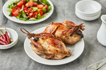 Delicious baked quail with  vegetable salad.  Delicious lunch or dinner 
