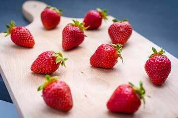 Fototapeta na wymiar Fresh ripe delicious strawberries on wooden board.