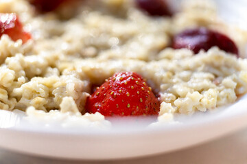 Homemade Porridge with strawberries. Hot and healthy food for breakfast
