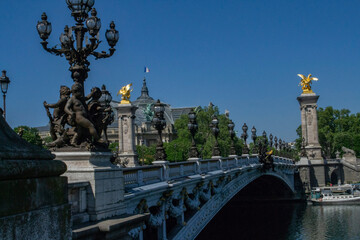 beautiful decorative statues on the bridge of Alexander III in Paris