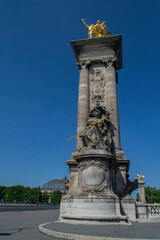 beautiful decorative statues on the bridge of Alexander III in Paris
