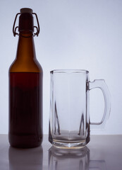 colored silhouette of a beer bottle with a cork and beer mug on a black white background