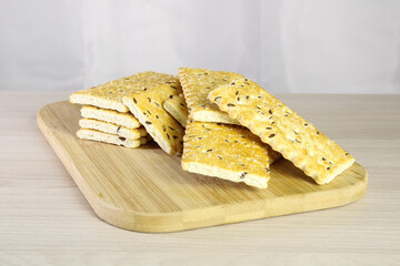 Cookies with sesame seeds and sugar sprinkles.