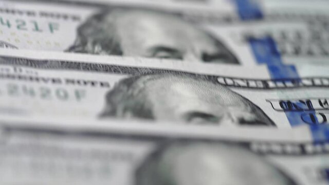 Macro lots of 100 american dollar bills. Cash money banknotes. Finance and investment concept. Closeup shot. Currency exchange of one hundred usd. Rich business economy of usa. Franklin's face texture