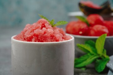 Homemade watermelon Granita on nice bright background, selective focus