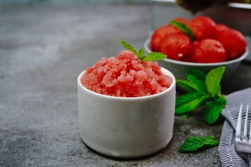 Homemade watermelon Granita on nice bright background, selective focus