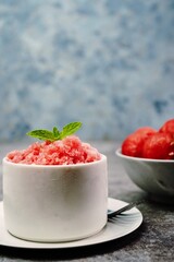 Homemade watermelon Granita on nice bright background, selective focus