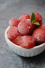 Frozen watermelon Balls in abowl, selective focus