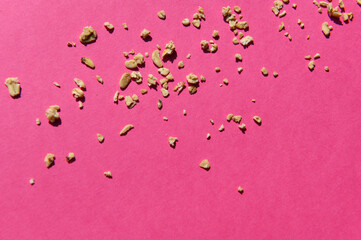 Granola on a pink background. Diet concept.