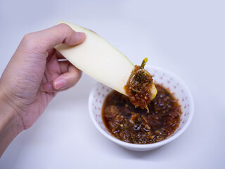 Mango with Sweet Fish Sauce on white background