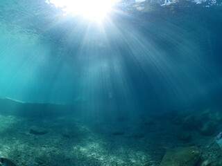 Fototapeta na wymiar sun beams sun rays sun shine underwater nice light ocean scenery reflections