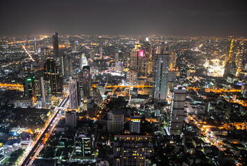 panoramic skyline of Bangkok by night from King Power Mahanakhon, Bangkok, Thailand