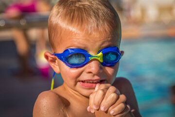 Little Boy At Pool With Goggles On