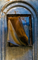 Very old vanished painting with frame, and dirty wall.