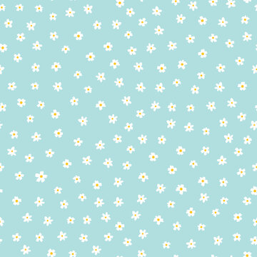 White ditsy flowers on blue seamless vector pattern. Floral background with small white flowers. Liberty style. Floral repeating texture for fashion prints. Ditsy print. Spring, summer decor