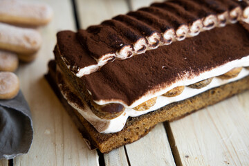 Tiramisu. Traditional italian dessert on wooden background. coffee break