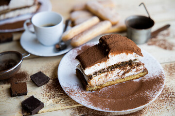 Tiramisu. Traditional italian dessert on wooden background. coffee break