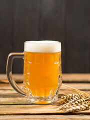 mug of beer on wooden table