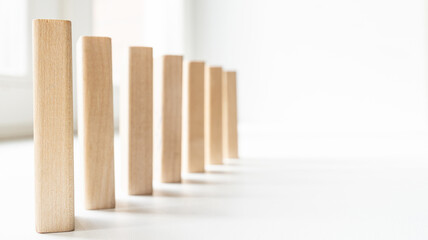 wooden blocks stand vertically one after another
