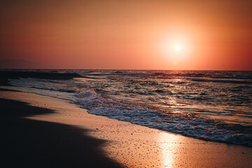Orange sunset over the city beach © Mykola Sushkov