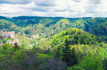 Fototapeta na wymiar Slavkov Forest aerial panoramic view with hills and green trees near Carlsbad town, Karlovy Vary district, West Bohemia, Czech Republic