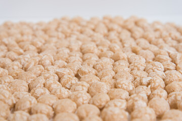 Balls for Breakfast, a side view. background texture. Beige shades.