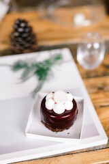 raspberry mousse cake on a wooden table