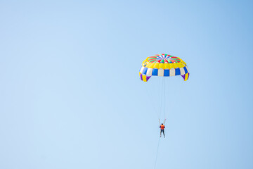 Parasailing in the blue sky of Cox's Bazar